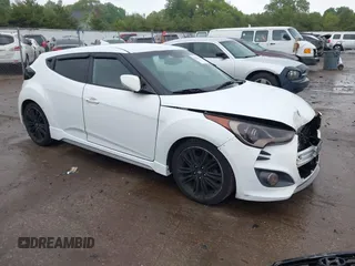 2016 Hyundai Veloster Turbo with VIN KMHTC6AE5GU297945, listed as a IAAI auction lot 42263573 with 130,797 mi miles and . Bid and sale history available at DreamBid. Image 1.
