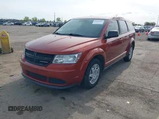 2014 Dodge Journey SE with VIN 3C4PDCAB8ET136794, listed as a IAAI auction lot 41986986 with 142,080 mi miles and . Bid and sale history available at DreamBid. Image 2.