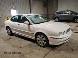 2004 Jaguar X-Type with VIN SAJEA51C34WE06046, listed as a Copart auction lot 56982105 with 69,265 mi miles and Clean Title. Bid and sale history available at DreamBid. Image 4.