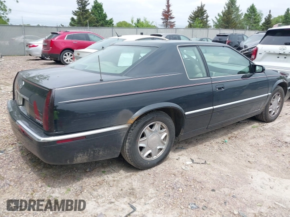 2002 Cadillac Eldorado ESC z VIN 1G6EL12Y82B105241, wystawiony jako IAAI lot #42241609 z przebiegiem 90 442 mil mil oraz . Historia ofert i sprzedaży dostępna na DreamBid. Obrazek 4.