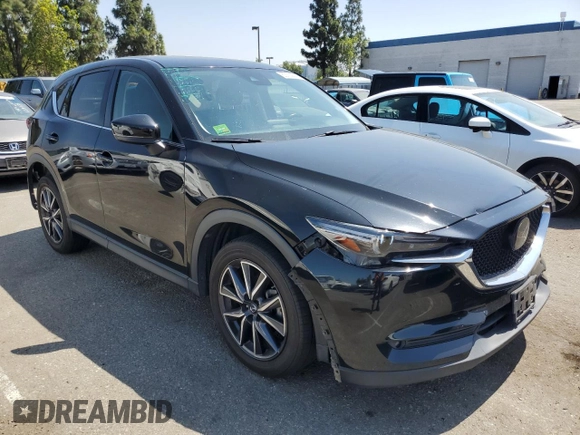 2018 Mazda CX-5 Grand Touring with VIN JM3KFBDM4J0348165, listed as a Copart auction lot 62733665 with 80,693 mi miles and Salvage title. Bid and sale history available at DreamBid. Image 4.