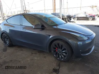 2021 Tesla Model Y Performance with VIN 5YJYGDEF4MF201989, listed as a IAAI auction lot 41658282 with 75,025 mi miles. Bid and sale history available at carsss.com. Image 1.