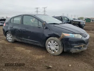 2010 Honda Insight LX with VIN JHMZE2H56AS022299, listed as a Copart auction lot 54872215 with 149,514 mi miles and Salvage title. Bid and sale history available at DreamBid. Image 4.