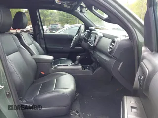 2021 Toyota Tacoma SR with VIN 3TMCZ5AN5MM380286, listed as a IAAI auction lot 42165523 with 58,965 mi miles and . Bid and sale history available at DreamBid. Image 5.