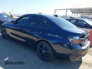 2015 BMW 3 Series 328i with VIN WBA3C1C50FK124300, listed as a IAAI auction lot 40112372 with 142,591 mi miles and . Bid and sale history available at carsss.com. Image 3.