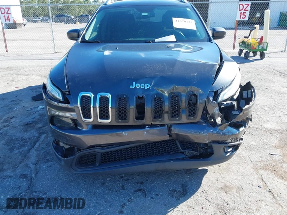 2016 Jeep Cherokee Altitude with VIN 1C4PJLCSXGW363598, listed as a IAAI auction lot 41670125 with 135,603 mi miles. Bid and sale history available at carsss.com. Image 6.