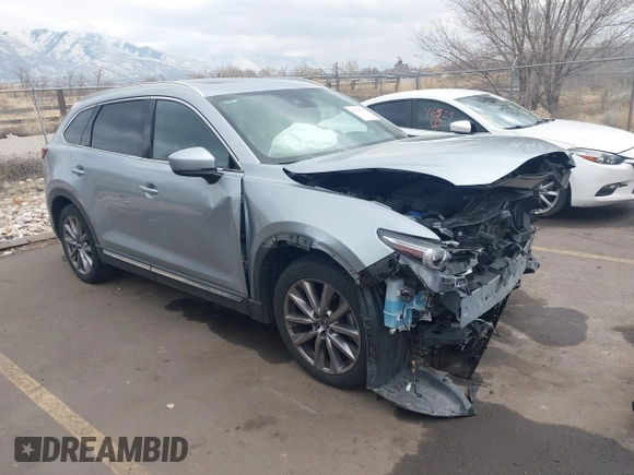 2021 Mazda CX-9 Grand Touring with VIN JM3TCBDY8M0515065, listed as a IAAI auction lot 41359765 with 80,221 mi miles and . Bid and sale history available at carsss.com. Image 1.