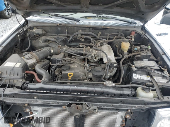 1999 Toyota Tacoma z VIN 4TAVL52N8XZ435689, wystawiony jako Copart lot #52162105 z przebiegiem 2 317 301 mil mil oraz Szkoda całkowita • Salvage title. Historia ofert i sprzedaży dostępna na DreamBid. Obrazek 11.