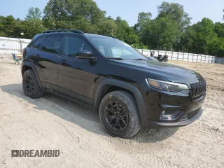 2022 Jeep Cherokee X with VIN 1C4PJMCX1ND526231, listed as a Copart auction lot 57551585 with 77,157 mi miles and Salvage title. Bid and sale history available at DreamBid. Image 4.