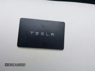 2023 Tesla Model 3 with VIN 5YJ3E1EA2PF588467, listed as a IAAI auction lot 42254921 with 11,217 mi miles and . Bid and sale history available at DreamBid. Image 11.
