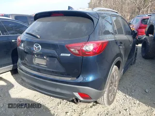 2016 Mazda CX-5 Grand Touring with VIN JM3KE2DY1G0708572, listed as a IAAI auction lot 41685298 with 109,427 mi miles. Bid and sale history available at carsss.com. Image 4.