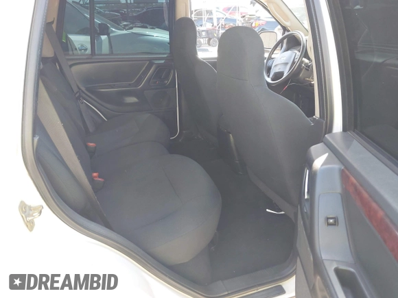 2003 Jeep Grand Cherokee Laredo with VIN 1J4GX48S43C518584, listed as a IAAI auction lot 42213094 with 163,743 mi miles and . Bid and sale history available at DreamBid. Image 8.