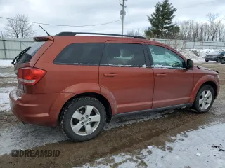 2013 Dodge Journey SE Plus with VIN 3C4PDCABXDT613045, listed as a Copart auction lot 88602235 with 255,617 mi miles and Salvage title. Bid and sale history available at DreamBid. Image 3.