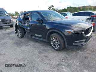 2021 Mazda CX-5 Grand Touring with VIN JM3KFBDM4M1385294, listed as a IAAI auction lot 42529905 with 80,000 mi miles and . Bid and sale history available at DreamBid. Image 1.