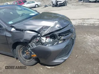 2019 Toyota Camry Hybrid LE z VIN 4T1B31HK0KU509265, wystawiony jako IAAI lot #42014204 z przebiegiem 136 560 mil mil oraz . Historia ofert i sprzedaży dostępna na DreamBid. Obrazek 6.