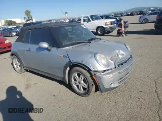 2005 MINI Convertible with VIN WMWRF33465TG10044, listed as a Copart auction lot 50364235 with 152,186 mi miles and Salvage title. Bid and sale history available at DreamBid. Image 4.