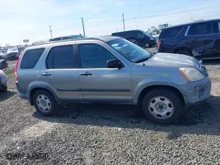 2006 Honda CR-V LX with VIN JHLRD68516C006561, listed as a IAAI auction lot 41855457 with 215,139 mi miles. Bid and sale history available at carsss.com. Image 13.