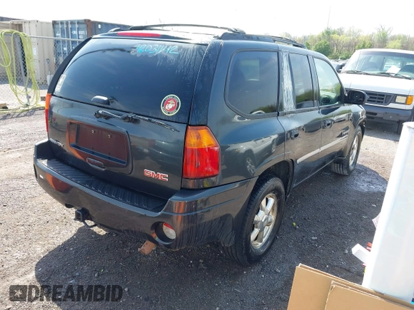 2006 GMC Envoy SLT with VIN 1GKDS13SX62247347, listed as a IAAI auction lot 42031142 with 263,599 mi miles. Bid and sale history available at carsss.com. Image 4.