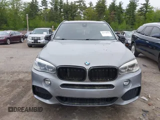 2014 BMW X5 xDrive50i with VIN 5UXKR6C54E0C02423, listed as a IAAI auction lot 42278044 with 122,370 mi miles and . Bid and sale history available at DreamBid. Image 12.