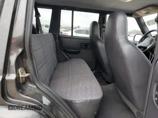 1999 Jeep Cherokee Sport with VIN 1J4FT68S2XL656679, listed as a Copart auction lot 88145875 with 254,038 mi miles and Salvage title. Bid and sale history available at DreamBid. Image 11.