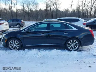 2013 Cadillac XTS Luxury with VIN 2G61R5S31D9106650, listed as a IAAI auction lot 41405091 with 143,545 mi miles. Bid and sale history available at carsss.com. Image 14.