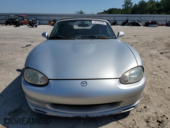 1999 Mazda MX-5 Miata z VIN JM1NB3538X0112611, wystawiony jako Copart lot #54732095 z przebiegiem 173 763 mil mil oraz Szkoda całkowita • Salvage title. Historia ofert i sprzedaży dostępna na DreamBid. Obrazek 5.