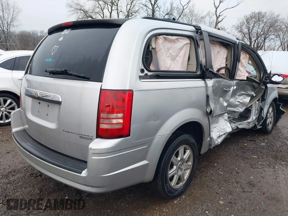 2010 Chrysler Town & Country Touring with VIN 2A4RR5D14AR293299, listed as a IAAI auction lot 41184584 with 245,928 mi miles. Bid and sale history available at carsss.com. Image 4.