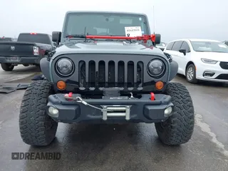 2013 Jeep Wrangler Rubicon 10th Anniversary with VIN 1C4BJWCG2DL651815, listed as a IAAI auction lot 41643919 with 98,297 mi miles and . Bid and sale history available at DreamBid. Image 12.
