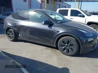2025 Tesla Model Y Long Range with VIN 7SAYGDED2SF228414, listed as a IAAI auction lot 41706470 with 11,319 mi miles and . Bid and sale history available at DreamBid. Image 13.