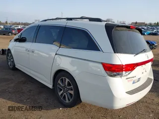 2014 Honda Odyssey Touring with VIN 5FNRL5H97EB037358, listed as a IAAI auction lot 41832825 with 208,894 mi miles and . Bid and sale history available at DreamBid. Image 3.
