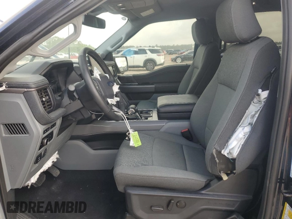 2024 Ford F-150 Lightning Flash with VIN 1FT6W3L7XRWG19735, listed as a Copart auction lot 54361215 with 7,764 mi miles and Salvage Title. Bid and sale history available at DreamBid. Image 7.
