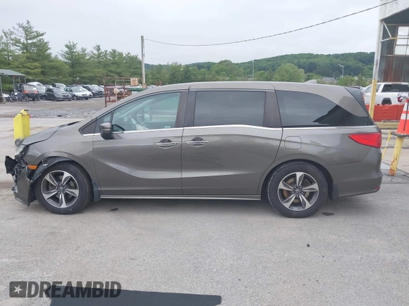 2018 Honda Odyssey Touring with VIN 5FNRL6H89JB057148, listed as a IAAI auction lot 42511909 with 166,438 mi miles and . Bid and sale history available at DreamBid. Image 14.