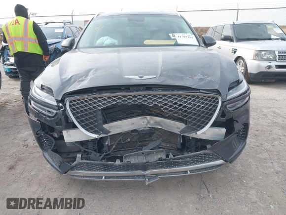 2022 Genesis GV70 2.5T with VIN KMUMADTB2NU065058, listed as a IAAI auction lot 41707351 with 77,831 mi miles and . Bid and sale history available at DreamBid. Image 6.