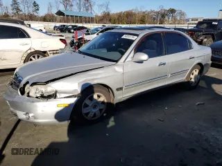 2006 Kia Optima LX z VIN KNAGD126165465793, wystawiony jako Copart lot #84859734 z przebiegiem 145 132 mil mil oraz Szkoda całkowita • Salvage title. Historia ofert i sprzedaży dostępna na DreamBid. Obrazek 1.