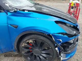 2021 Tesla Model Y Performance z VIN 5YJYGDEF8MF209819, wystawiony jako IAAI lot #41757009 z przebiegiem 37 685 mil mil oraz . Historia ofert i sprzedaży dostępna na DreamBid. Obrazek 6.