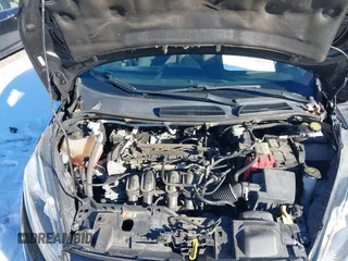 2014 Ford Fiesta S z VIN 3FADP4TJ7EM165272, wystawiony jako IAAI lot #41332917 z przebiegiem 115 508 mil mil oraz . Historia ofert i sprzedaży dostępna na DreamBid. Obrazek 10.