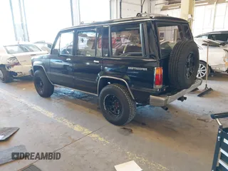 1991 Isuzu Trooper z VIN JACCH58R8M7902476, wystawiony jako IAAI lot #41893980 z przebiegiem 169 269 mil mil oraz . Historia ofert i sprzedaży dostępna na DreamBid. Obrazek 3.