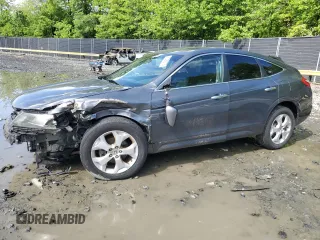 2011 Honda Crosstour EX-L z VIN 5J6TF2H52BL005199, wystawiony jako Copart lot #57080375 z przebiegiem 157 221 mil mil oraz Szkoda całkowita • Salvage title. Historia ofert i sprzedaży dostępna na DreamBid. Obrazek 1.
