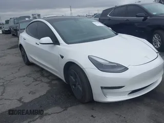 2021 Tesla Model 3 Long Range with VIN 5YJ3E1EB6MF878957, listed as a IAAI auction lot 41915482 with 59,578 mi miles. Bid and sale history available at carsss.com. Image 1.
