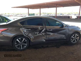 2015 Nissan Altima SL z VIN 1N4AL3AP0FC233740, wystawiony jako IAAI lot #42239684 z przebiegiem 111 970 mil mil oraz . Historia ofert i sprzedaży dostępna na DreamBid. Obrazek 13.