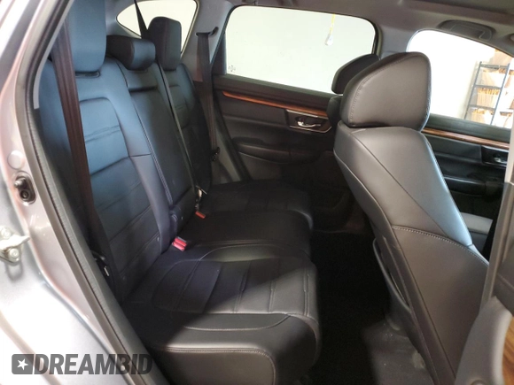 2018 Honda CR-V Touring z VIN 7FARW2H95JE012947, wystawiony jako Copart lot #64779925 z przebiegiem 20 561 mil mil oraz Szkoda całkowita • Salvage title. Historia ofert i sprzedaży dostępna na DreamBid. Obrazek 11.