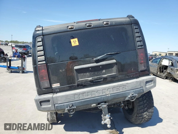 2005 Hummer H2 SUV with VIN 5GRGN23U95H101796, listed as a Copart auction lot 76991574 with 88,204 mi miles and Salvage Title. Bid and sale history available at carsss.com. Image 6.