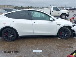 2023 Tesla Model Y Performance with VIN 7SAYGDEF7PF807312, listed as a IAAI auction lot 41711068 with 25,029 mi miles and . Bid and sale history available at DreamBid. Image 12.