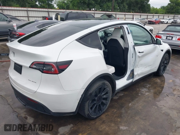 2022 Tesla Model Y Long Range z VIN 7SAYGDEE2NF420882, wystawiony jako IAAI lot #42023642 z przebiegiem 19 783 mil mil oraz . Historia ofert i sprzedaży dostępna na DreamBid. Obrazek 4.