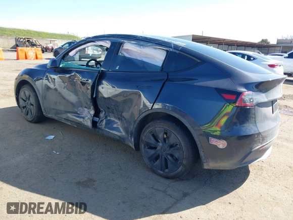 2024 Tesla Model Y with VIN 7SAYGDED8RF213796, listed as a IAAI auction lot 41634130 with 7,710 mi miles and . Bid and sale history available at DreamBid. Image 3.
