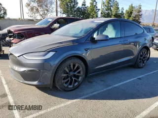 2022 Tesla Model X with VIN 7SAXCDE53NF362689, listed as a Copart auction lot 86924464 with 51,621 mi miles and Salvage Title. Bid and sale history available at carsss.com. Image 1.