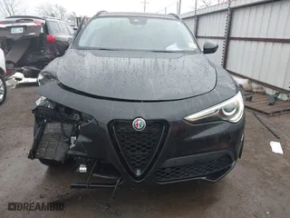 2021 Alfa Romeo Stelvio Ti with VIN ZASPAKBN0M7D02795, listed as a IAAI auction lot 41052309 with 83,584 mi miles. Bid and sale history available at carsss.com. Image 13.