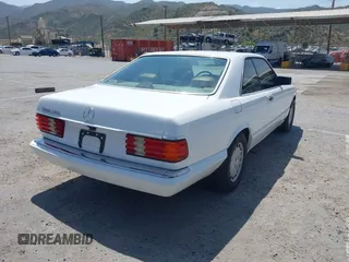 1991 Mercedes-Benz 560 with VIN WDBCA45E7MA610580, listed as a IAAI auction lot 42099161 with 83,344 mi miles and . Bid and sale history available at DreamBid. Image 4.