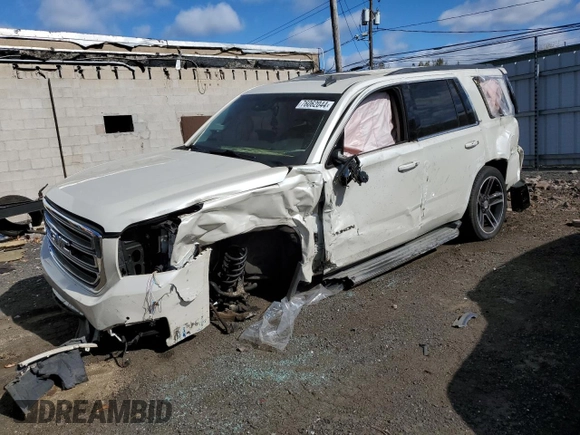2015 GMC Yukon SLT with VIN 1GKS2BKC3FR143491, listed as a Copart auction lot 76062044 with Not Provided miles and Salvage Title. Bid and sale history available at DreamBid. Image 1.