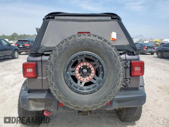 2018 Jeep Wrangler Unlimited Rubicon with VIN 1C4HJXFG6JW166731, listed as a Copart auction lot 56997385 with 117,713 mi miles and Salvage title. Bid and sale history available at DreamBid. Image 6.